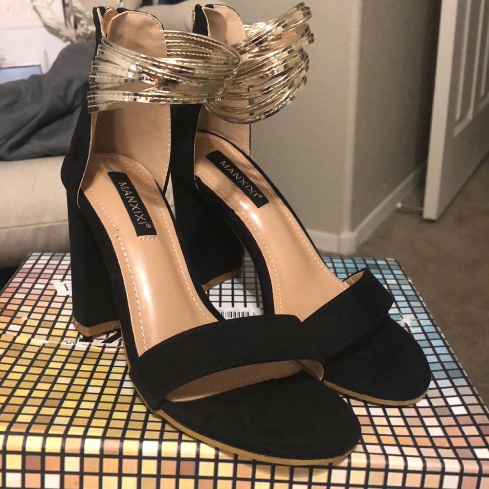 Never worn, black and gold heels!